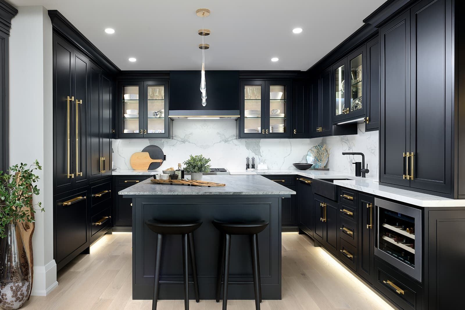 Custom remodeled kitchen with dark cabinetry and island