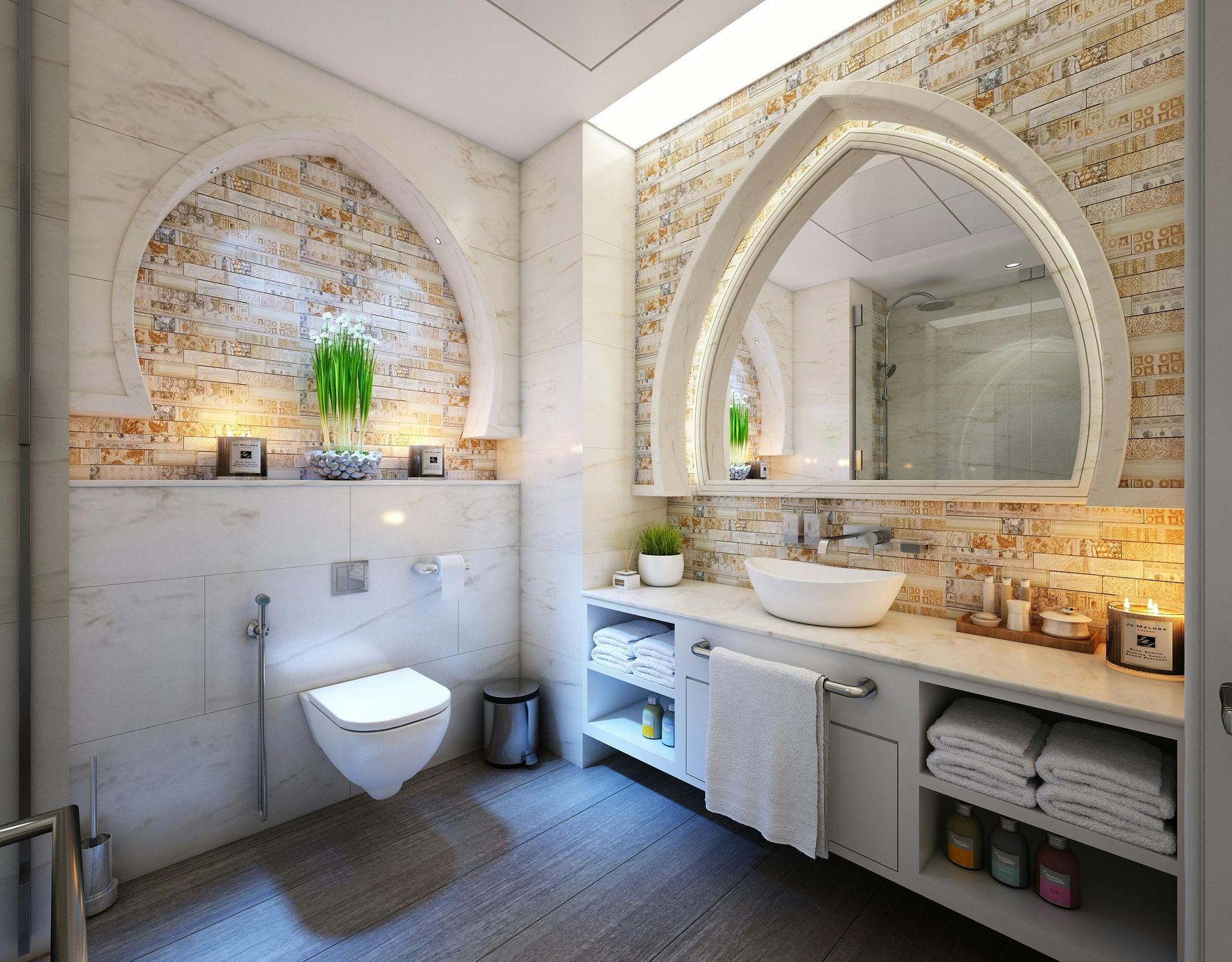 Luxurious bathroom with arched mirror and backsplash, white sink, toilet, and shelving, featuring neutral tones.