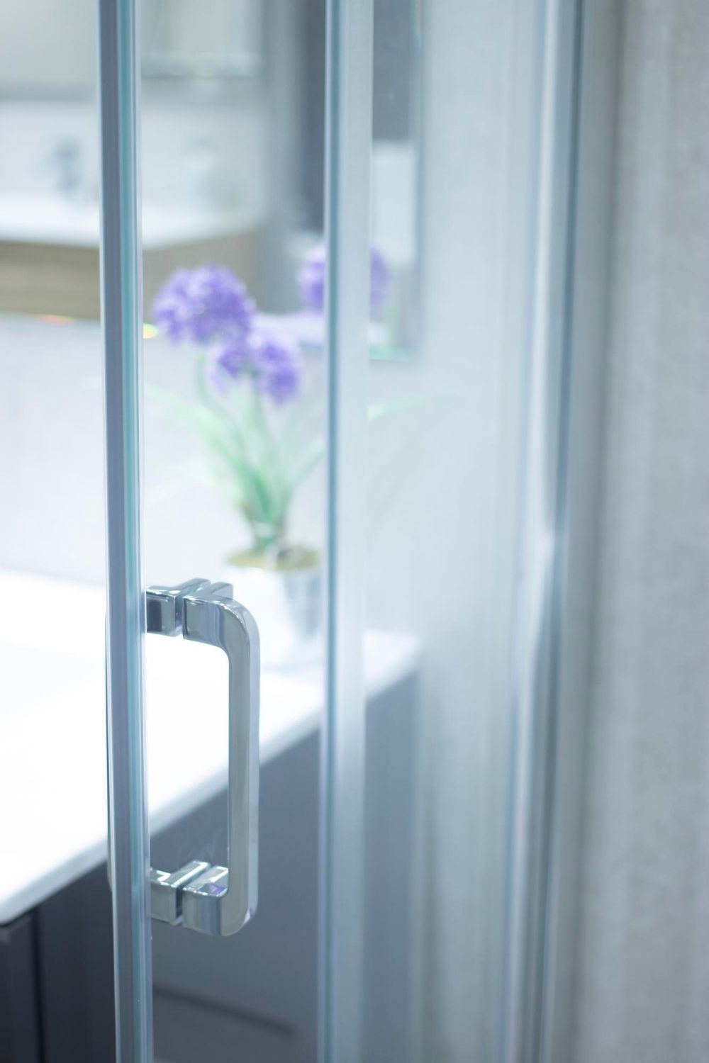 Detail of a custom glass shower door handle